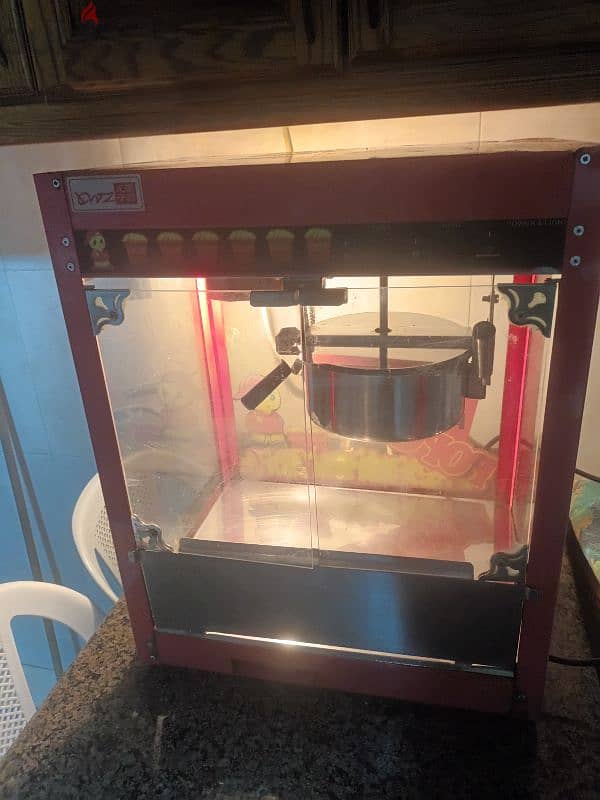 جهاز عمل بوشار A modern, automatic popcorn machine 3