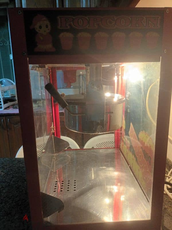 جهاز عمل بوشار A modern, automatic popcorn machine 4