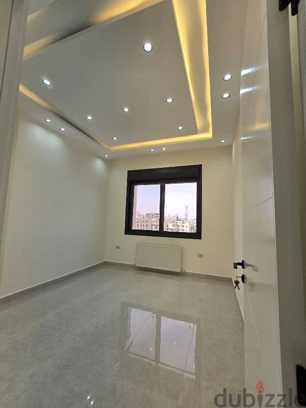 شقق للبيع في أجمل مواقع ضاحية الرشيد مطلة علي شارع الجامعة 1